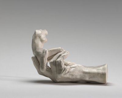 Rodins hand med en kvinnlig figur av Auguste Rodin
