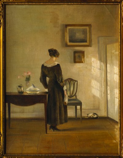 En interiör med en kvinna som matar en katt (olja på duk) av Carl Holsoe