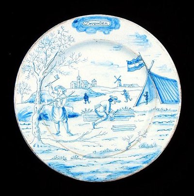 Delftware-tallrik föreställande december månad (tennglaserat lergods) av Dutch School