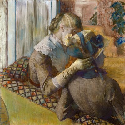 Hos fashionisten. En kund som provar en hatt av Edgar Degas