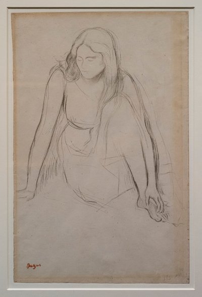 Kvinna som sitter vid vattenbrynet. Omkring 1867-1868. Svart penna på velinpapper. av Edgar Degas