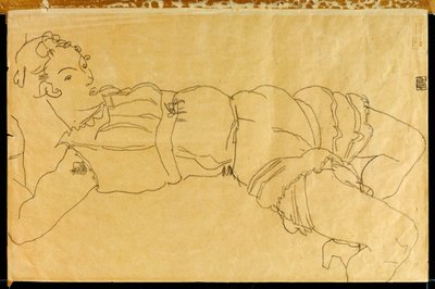 Ung kvinna liggande på rygg, 1915 av Egon Schiele