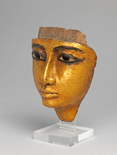 Ansikte från en kista, med ögon och ögonbryn inlagda, förgyllda av Egyptian 20th Dynasty