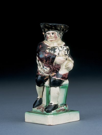 Dick Whittington-kanna, formgjuten reser sig från en stol med hög rygg, håller sin katt, plaskad i bruna, gröna och svarta kläder, en formgjuten sköld vid hans sida, ca 1790 av English School