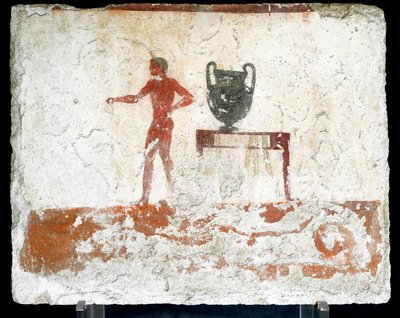 Etruskisk konst: en ung naken ephebe nära ett bord där en vas är placerad. Fresk av "dykarens grav". Från Paestums södra kyrkogård. 480-470 f.Kr. Museo Archeologico Nazionale, Paestum av Etruscan