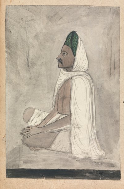 Man i en grön turban sitter med korsbenen av Gangaram Chintaman Tambat