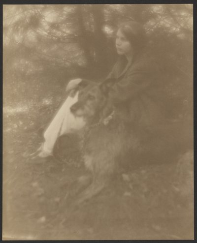 [Sittande kvinna med hund] av George H. Seeley