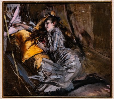 Liggande flicka i tartanklänning av Giovanni Boldini