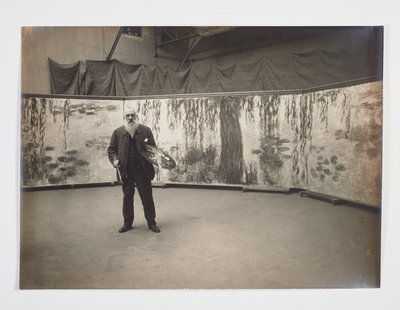 Claude Monet med sin palett framför sitt verk 