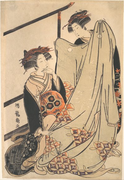 Två skönheter som tittar på en kimono av Isoda Koryusai