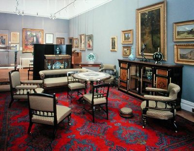 Svit bestående av ett skåp, mittbord, soffa, ett par sidostolar, ett par fåtöljer, amningsstol, fåtölj och kortbord, 1880-tal (mahogny) av James Lamb of Manchester
