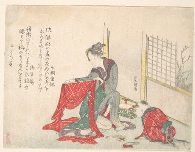 Kvinna som viker tyg av Katsushika Hokusai