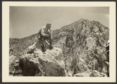 [Man Atop Rocks] av Louis Fleckenstein