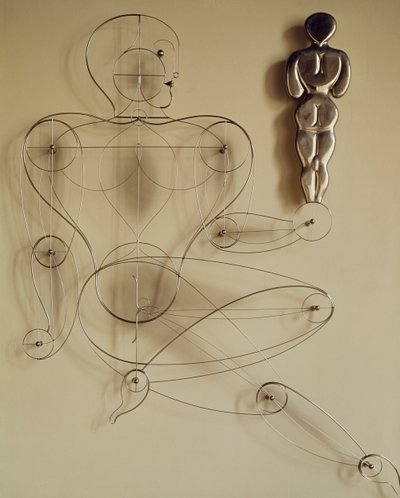 Homo, trådfigur med figur bakifrån i handen av Oskar Schlemmer