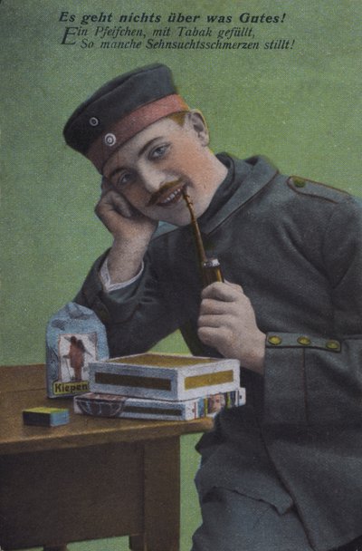 Tysk soldat röker sin pipa (färgad bild) av Photographer German