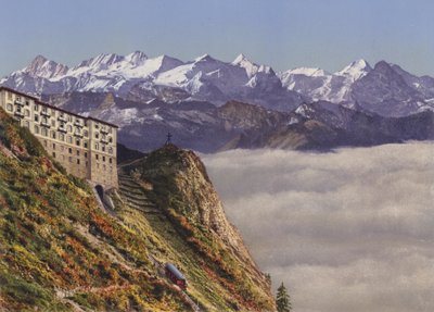 Stanserhorn 1900m linbana och hotell med Bernese Alps (färgfoto) av Photographer Swiss