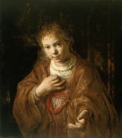 Ung flicka håller i en medalj av Rembrandt