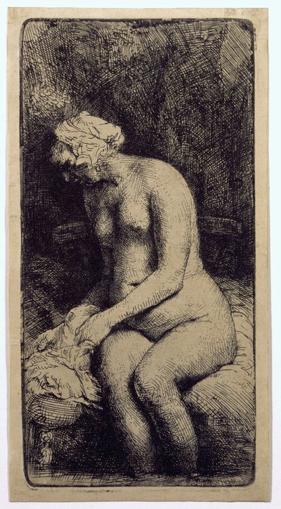 En kvinna som badar sina fötter vid en bäck av Rembrandt van Rijn