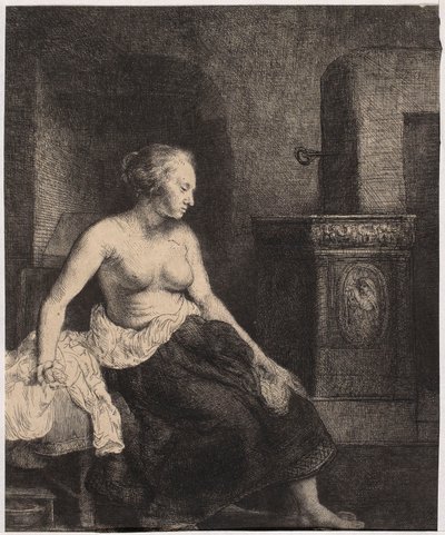 En halvnaken kvinna som sitter vid kaminen av Rembrandt van Rijn