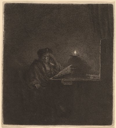 Student vid ett bord vid levande ljus av Rembrandt van Rijn