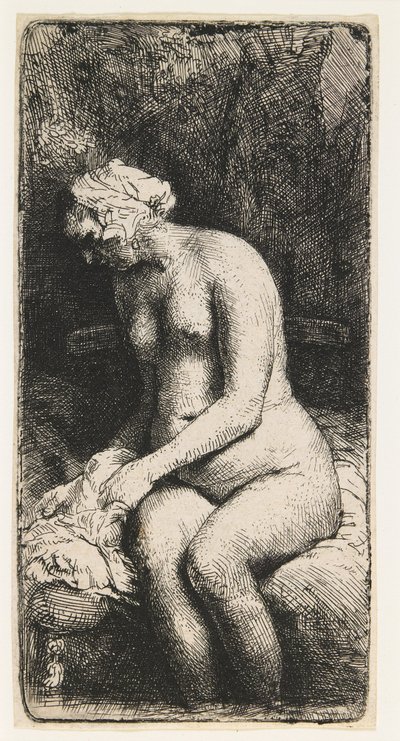 Kvinna som badar sina fötter vid en bäck av Rembrandt van Rijn