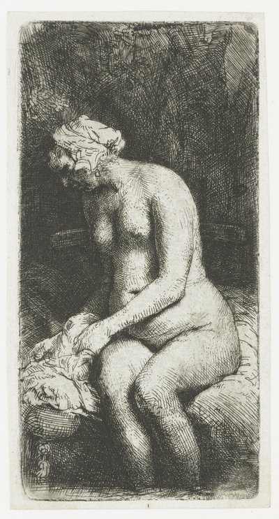 Kvinna som badar fötterna vid en bäck av Rembrandt van Rijn