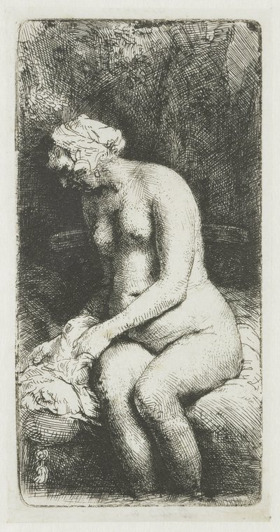 Kvinna som badar fötterna vid en bäck av Rembrandt van Rijn