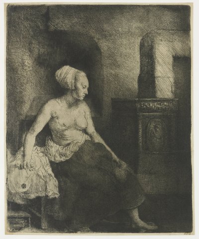 Kvinna som sitter halvklädd bredvid en spis av Rembrandt van Rijn