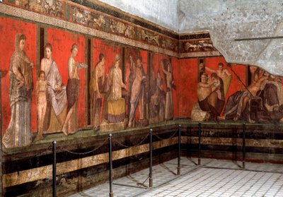 Initiering till dyrkan av Dionysos: en ung man introduceras till tillbedjan, läser ritualen och en liten pojke ger ett offer. 1:a århundradet f.Kr. Fresk av Villa des Mysteres (Misteri) i Pompei. Italien - Initiationsriter av Dionysoskulten: ett du av Roman