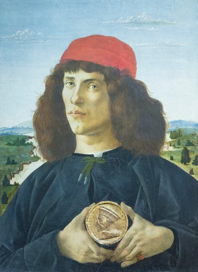 Porträtt av en ung man som håller en medaljong av Cosimo de