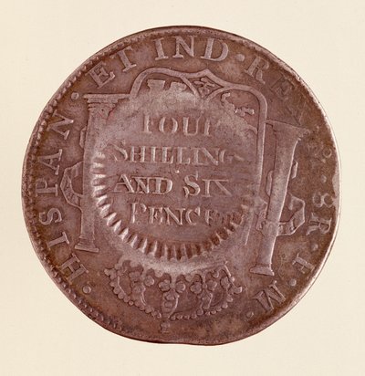 Silvermynt (8 realer) från Spanien: Karl III:s regeringstid (1759-1788). 1777 med motstämpel av 1787. Diam. 3,9 cm Neapel, museo archeologico av Spanish School