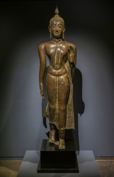 Buddha går. Thailand. Thailändsk konst av Sukhothai, 1400-1500-talet av Thai School