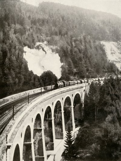 I Semmeringdalen, Österrike. Ett bra tåg som korsar den krökta Gamperl-viadukten, 1935-36. av Unbekannt