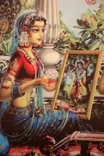Målning föreställande Radha tittar på en bild av Krishna. Indien av Unbekannt