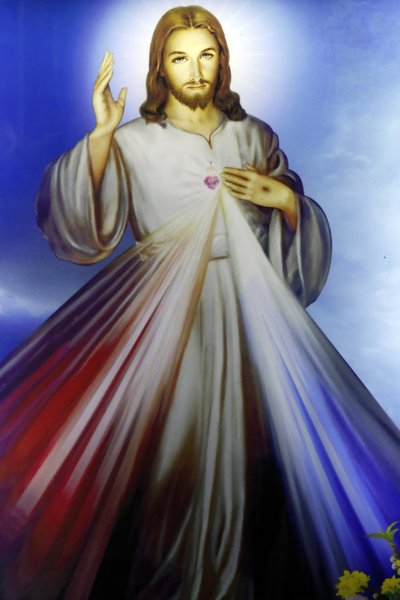 Butik som säljer religiösa kristna föremål. Barmhärtige Jesus, jag litar på dig. Ho Chi Minh City. Vietnam av Unbekannt