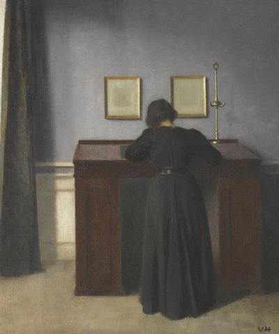 Ida står vid ett skrivbord av Vilhelm Hammershøi