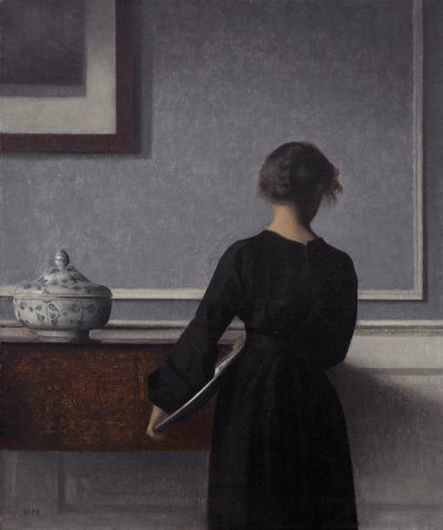 Interiör med ung kvinna bakifrån av Vilhelm Hammershøi