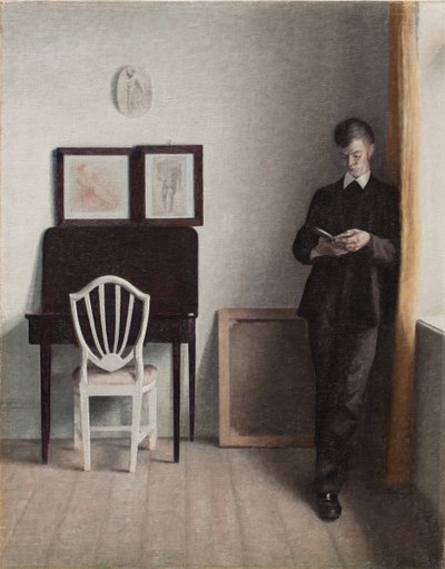 Interiör med en ung man som läser av Vilhelm Hammershoi