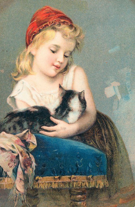 En ung flicka poserar med en katt av English School