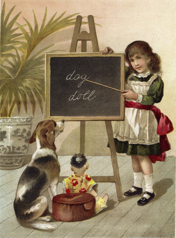 Flicka, utbildande hund och docka av English School