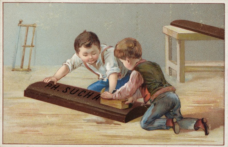 Barn som bygger en stor chokladkaka i trä, reklam för Suchard Choklad av French School
