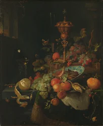 Stilleben med frukt och en bägare på en tuppfot