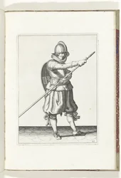 Sköld- och spikövningen: Soldaten ger tillbaka spiken i position med båda händerna (nr 29), 1618 Nassausche Wapen-Handelinge, van Schilt, Spies, Rappier and the Targe: beyde figuerlick avbildad, och den inramade efter den nya ordningen [av] (...) Ma