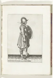 Sköld- och spikövningen: Soldaten med skölden redo och spiken på marken bredvid sin högra fot (nr 17), 1618 Nassausche Wapen-Handelinge, van Schilt, Spies, Rappier and the Targe: beyde figuerlick avbildad, slut inramad efter den nya