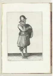 Sköld- och spikövningen: Soldaten drar sin arm från sköldens bälte (nr 25), 1618 Nassausche Wapen-Handelinge, van Schilt, Spies, Rappier and the Targe: beyde figuerlick avbildad, och den inramade efter den nya ordningen [av] (...) Maurits