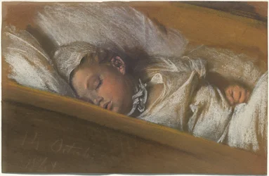 Ett spädbarn sover i sin spjälsäng