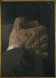 Manlig hand som håller en tavla