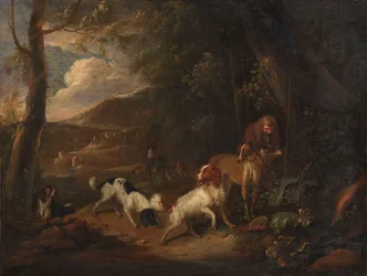 Jägare med hundar vid kanten av en skog