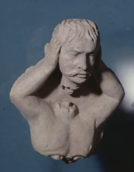 Demon som lossar sitt huvud, grekisk-buddhistisk stil, från Hadda, 1:a-4:e århundradet