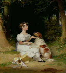 En ung flicka med sin spaniel